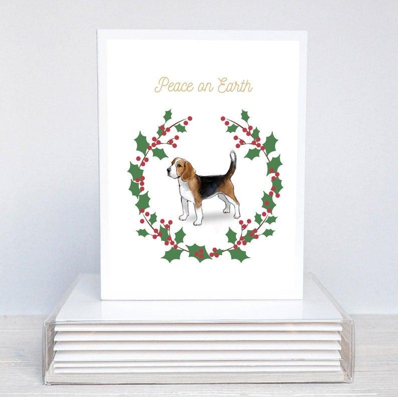 beagle in festive holiday wreath with words Peace on Earth